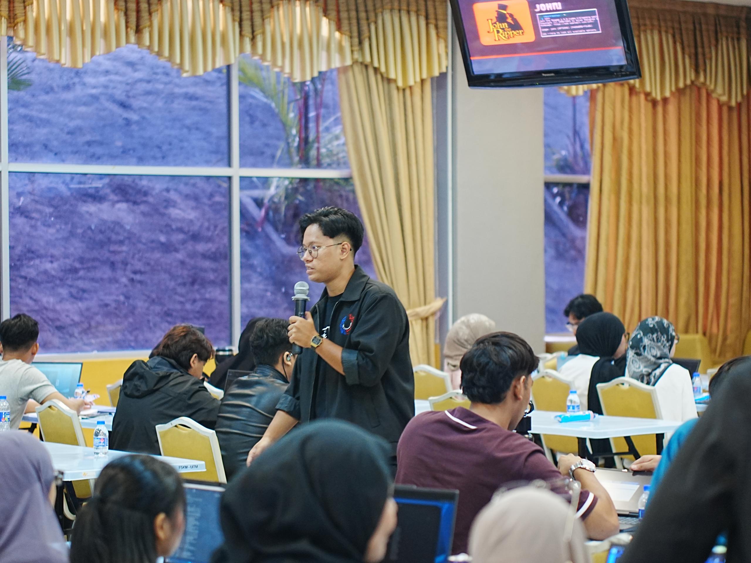 Razlan presenting during the Road to White Hat Gen 6 workshop, image 2 of 4